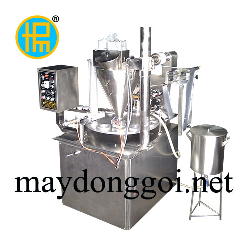 Máy chiết rót – dán miệng ly chè cẩm (mâm xoay)